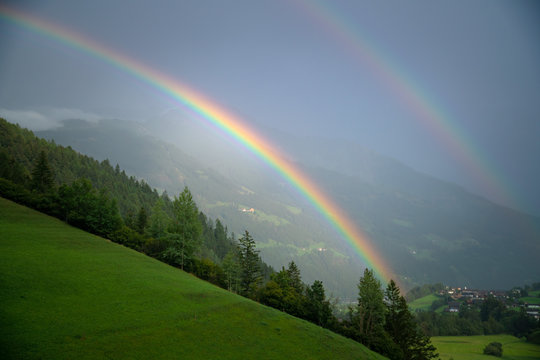 Double Rainbow over lush alpine landscape, Lienz, Austria