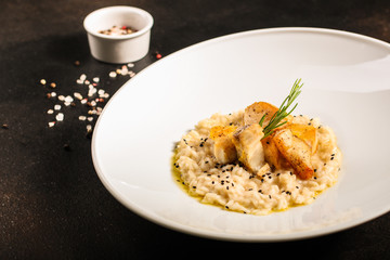 risotto fish (main course rice with seafood) menu concept. food background. copy space. Top view