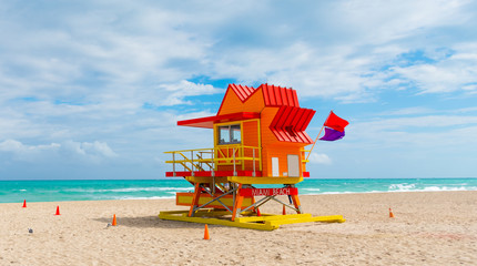 Colorful lifeguard tower under a cloudy sky in Miami Beach,