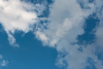 white clouds in the blue sky during