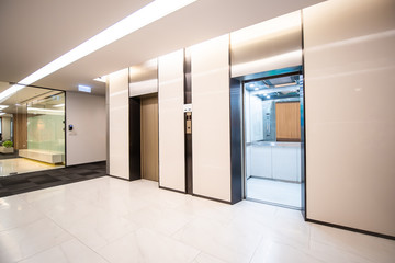 Modern steel elevator cabins in a business lobby or Hotel, Store, interior, office,perspective wide...