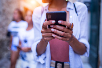 Unrecognizable woman using phone,selective focus on the phone