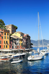 Fototapeta na wymiar Beautiful promenade with ships and boats in Portofino in Italy