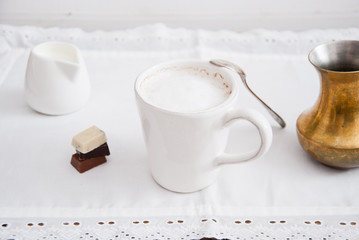Home Cooked coffee with milk in a white cup