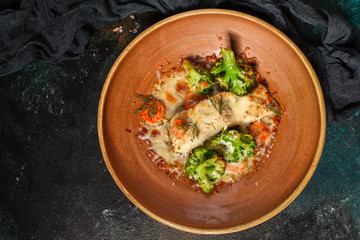 fish with broccoli (delicious fish dish, baked main course) menu concept. food background. copy space. Top view