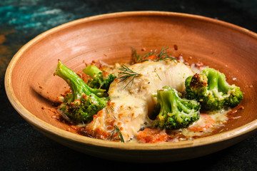 fish with broccoli (delicious fish dish, baked main course) menu concept. food background. copy space. Top view