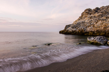 Obraz premium First hours of the day at Cantarrijan beach, the best nudist beach on the Costa del Sol and Costa Tropical of Granada