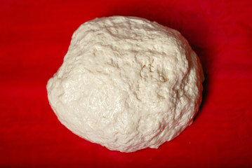 close up of flour dough on table, baking concept