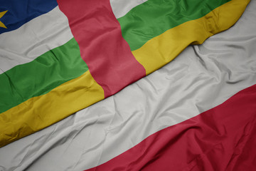 waving colorful flag of poland and national flag of central african republic.