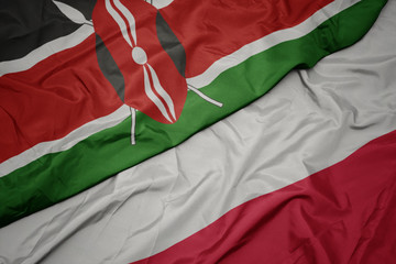 waving colorful flag of poland and national flag of kenya.