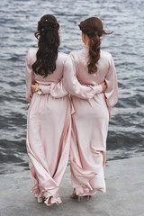 Bridesmaid on the background of the lake.