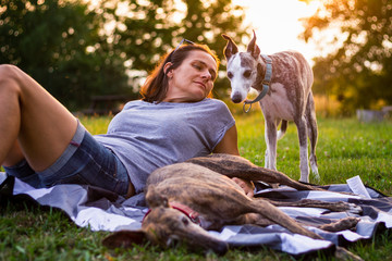 Woman relaxation with her dogs outdoors