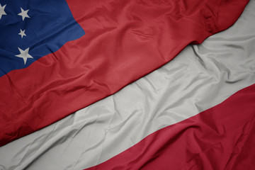 waving colorful flag of poland and national flag of Samoa .