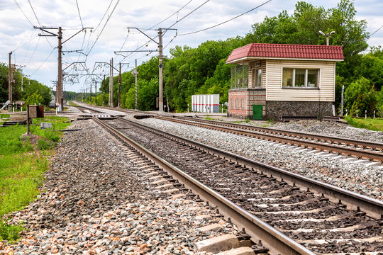 Double track electrified railway line with railway crossing