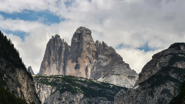 moving clouds above the Tre Cime di Lavaredo mountain group or Drei Zinnen as seen from Valle di Landro near Dobbiaco. Sexten Dolomites, South Tyrol, Italy. Timelapse, 4K UHD Video.