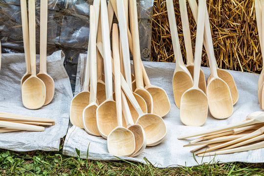 Various wooden utensils in retro style. The devices are sold at the fair.