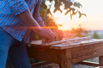 Elderly male woodworker hands