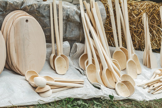 Various wooden utensils in retro style. The devices are sold at the fair.