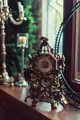 Vintage clock on the windowsill