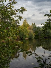 Fototapeta na wymiar Autumn, trees, river, clouds.