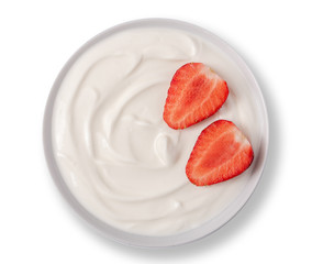 Yogurt in white bowl with strawberries and on the top on white background.