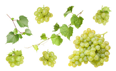 Set of fresh juicy grapes and leaves on white background