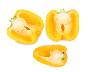 Naklejka na ściany i meble Cut yellow bell peppers isolated on white, top view