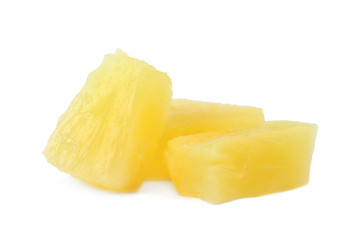 Pieces of delicious sweet canned pineapple on white background