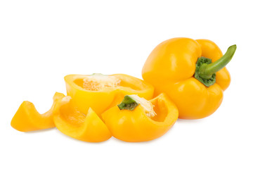 Whole and cut yellow bell peppers isolated on white