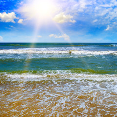 Beautiful seascape and sun on blue sky background.