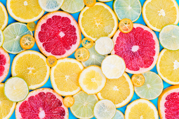 Orange, grapefruite, lime, lemon on the background. Citrus on the blue background
