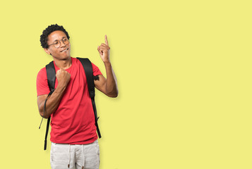 Young man making a number one gesture
