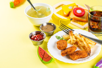 Kids menu concept - pasta, nuggets, french fries, soups, cola copy space