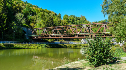 Fototapeta premium Idyllic Lahn River with Railway Bridge
