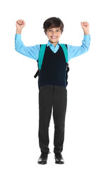 Happy boy in school uniform on white background