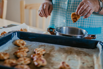 woman making traditional Christmas sweets and desserts
