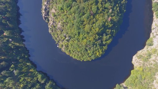 Aerial view of Vltava river horseshoe meander with green forest near Maj view point next to Prague in central Bohemia, Czech republic