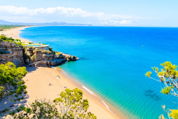 Azure blue sea water at Cala Moreta beach and view of rocks, Costa Brava, Catalonia, Spain
