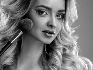 Obraz premium Beauty portrait of blonde beautiful woman with perfect makeup and hair style, isolated. Spa and hair, healthy skin