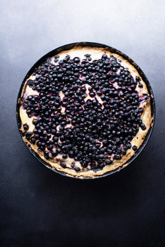 Top view image of blueberry tart with cream