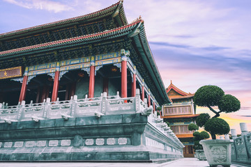 Exterior of Chinese temple at sunset, twilight time at Chinese temple, It is Chinese style architecture that popular attraction and located in Thailand.