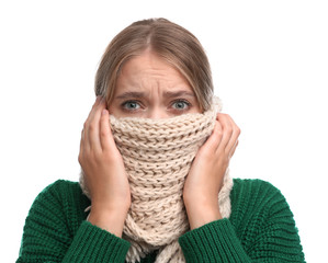 Young woman suffering from cold on white background
