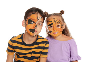 Cute little children with face painting on white background