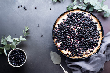 Top view image of blueberry tart with cream