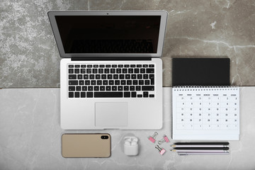 Flat lay composition with laptop on marble table. Designer workplace