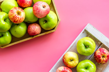 Autumn composition with fresh apples on pink background top view copy space