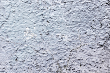 background of the wall with gray paint and cracks