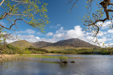 Connemara landscape with Pollacapall Lough in the foreground and mountains in the background