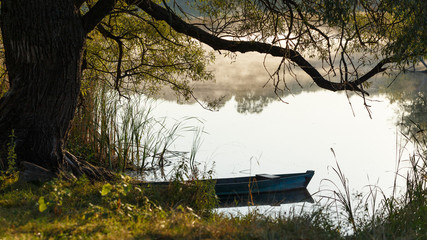 Traditional Ukrainian countryside, Gogol places. Picturesque view of morning river, vintage wooden...