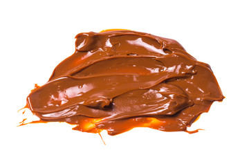 Melted tasty caramel splashes isolated on white background.